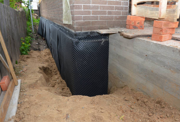 SJ Waterproofing Pros technician performing targeted Waterproofing assessment in Columbia City, OR
